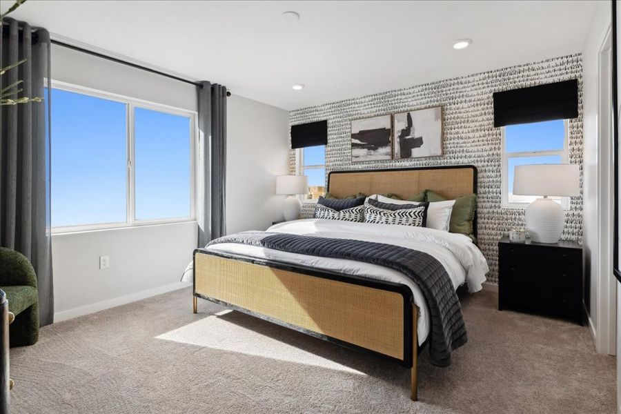 A bedroom with a large bed. A bedroom with a large bed.
