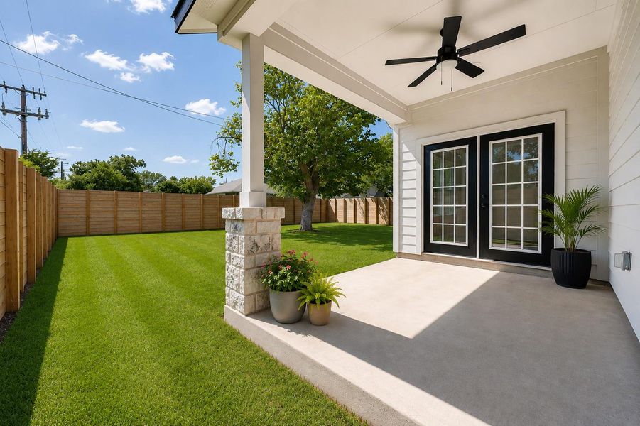 A well-manicured backyard with a spacious concrete patio provides a serene outdoor living area, perfect for relaxation. A well-manicured backyard with a spacious concrete patio provides a serene outdoor living area, perfect for relaxation.