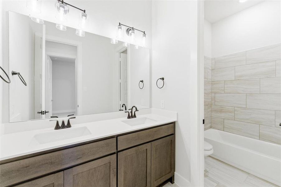 Bathroom with double vanity and  shower combination