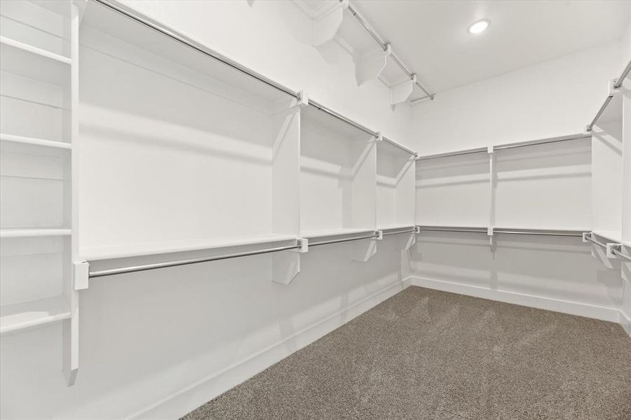 You'll find seasonal hanging racks and plenty of space in this dream closet!