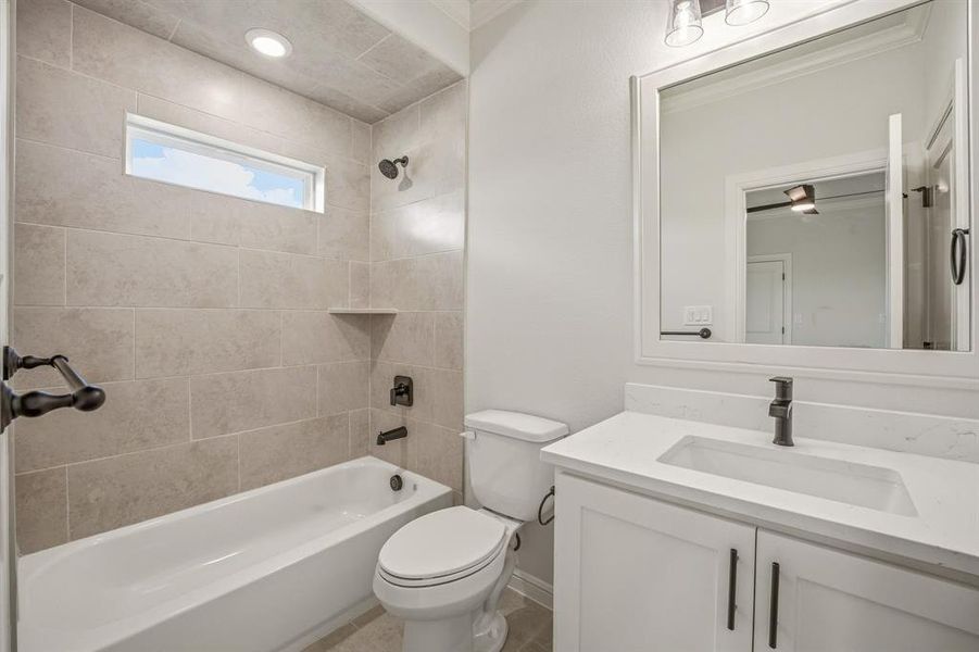 Full bathroom featuring vanity, shower / tub combination, and recessed lighting