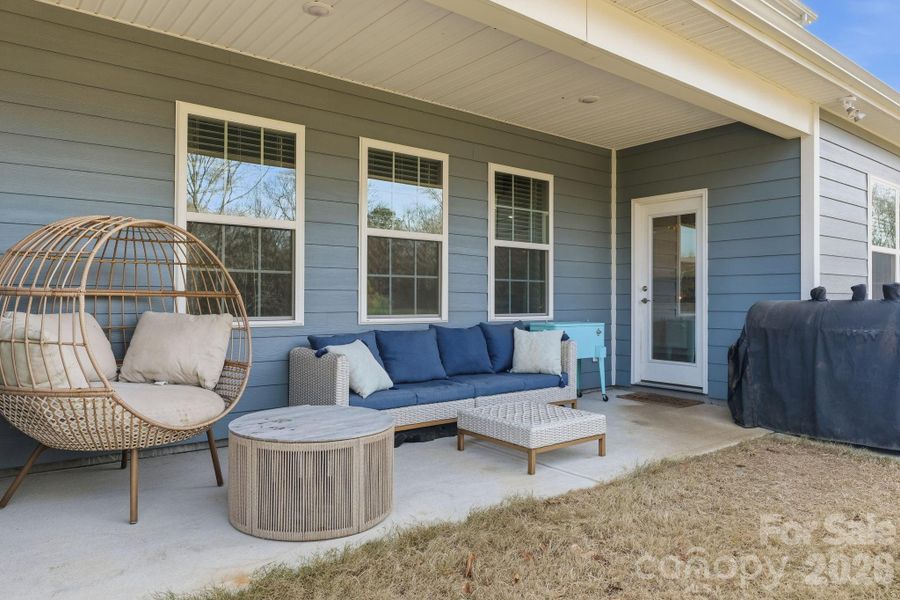 The back covered patio provides a tranquil spot to take in the views in your large back yard