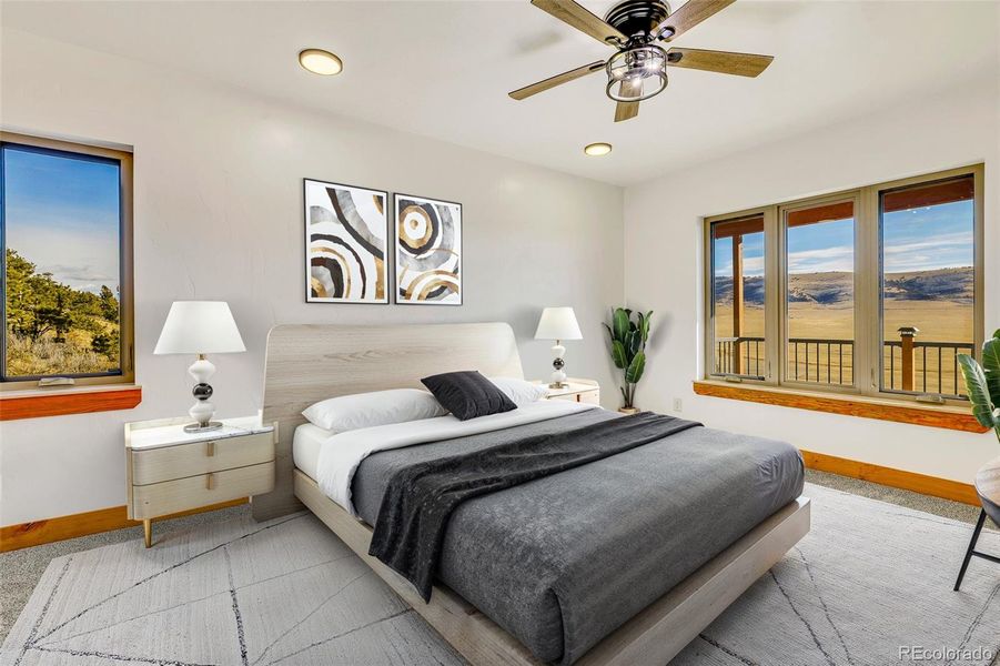 Virtually staged main level primary bedroom.