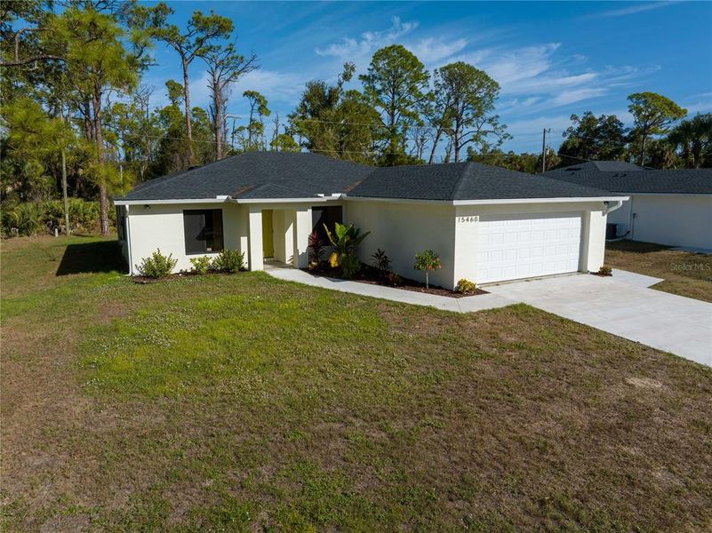 Front exterior of a new home in , Port Charlotte, FL, highlighting curb appeal (Image 1). Front exterior of a new home in , Port Charlotte, FL, highlighting curb appeal (Image 1).