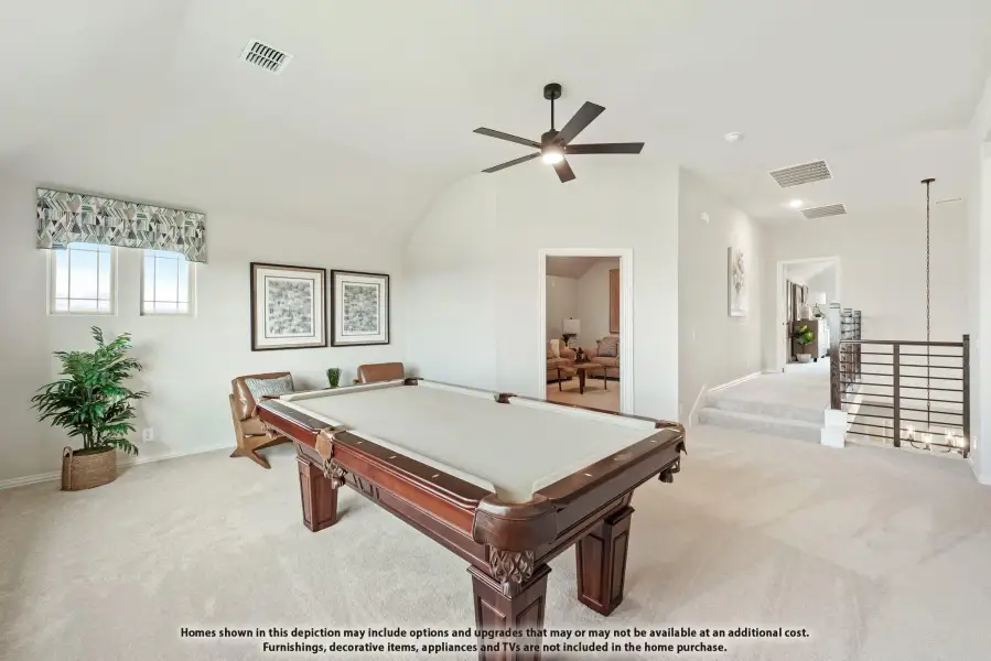 Game room with pool table, vaulted ceiling, ceiling fan, and carpet flooring near staircase landing Game room with pool table, vaulted ceiling, ceiling fan, and carpet flooring near staircase landing
