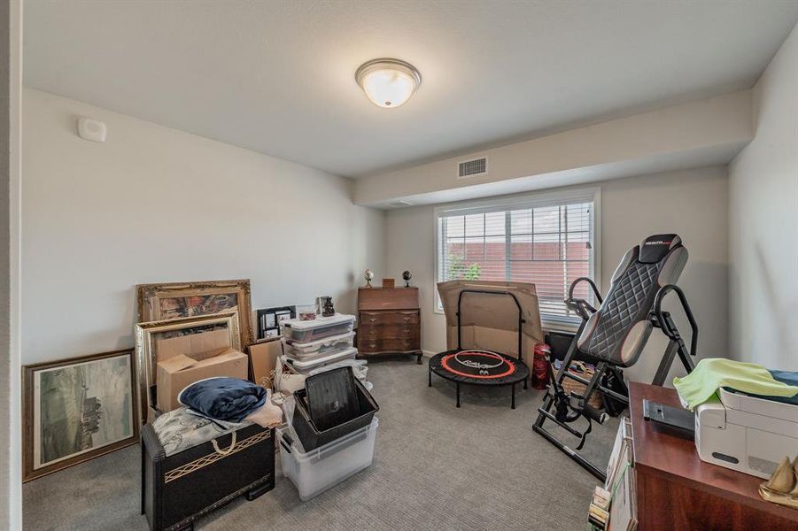 Second bedroom that can be used as a flex space for an office or work out area.
