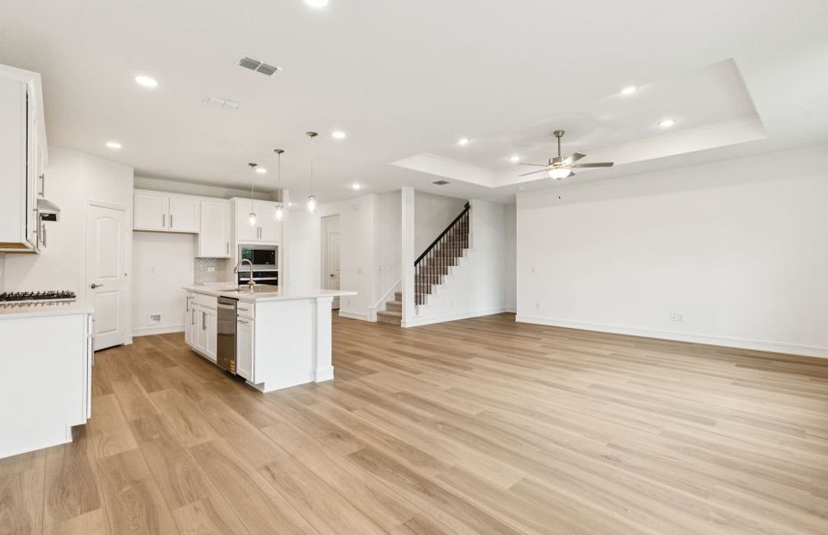 Open concept gathering room creating a spacious and inviting atmosphere  *Real home pictured