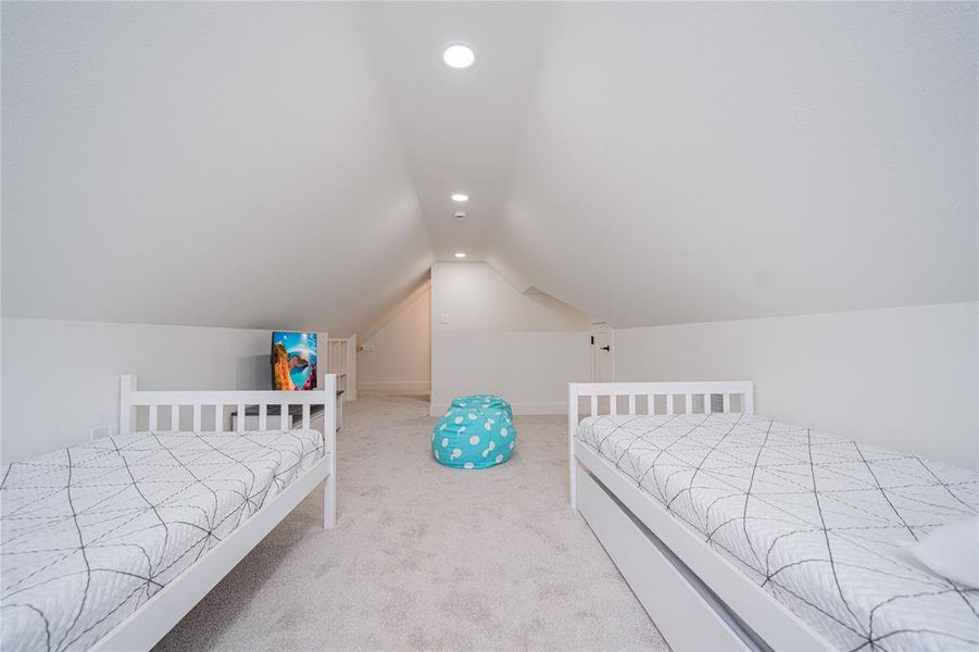 Bedroom featuring recessed lighting, carpet, and vaulted ceiling Bedroom featuring recessed lighting, carpet, and vaulted ceiling