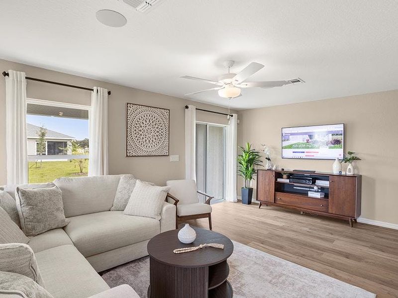 This 2-story, end-unit townhome features a sunny and open living area - Isla townhome by Highland Homes