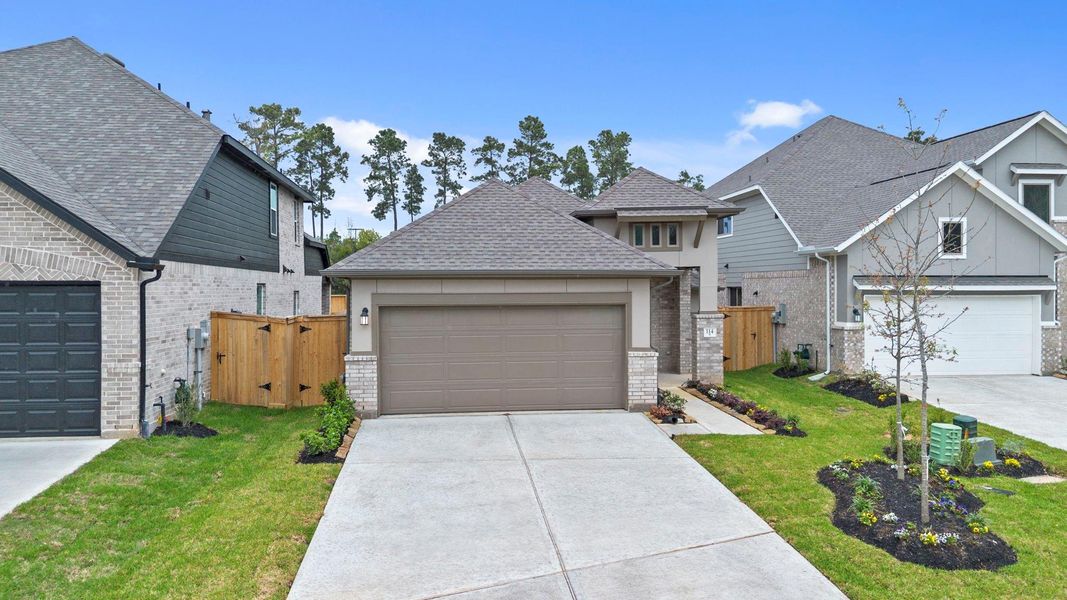 Front exterior of a new home in Grand Central Park, Conroe, TX, highlighting curb appeal (Image 21).