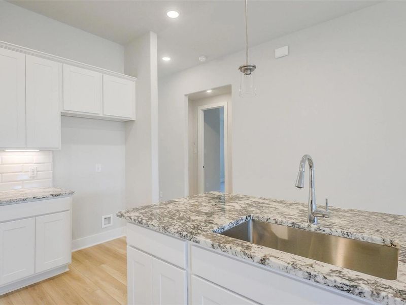 Close-up of interior finishes inside a home in Sunterra, Katy (Image 14).