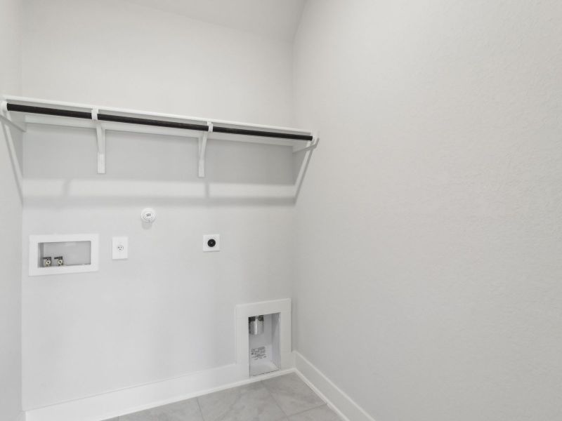 Laundry room in the San Saba floorplan at a Meritage Homes community.
