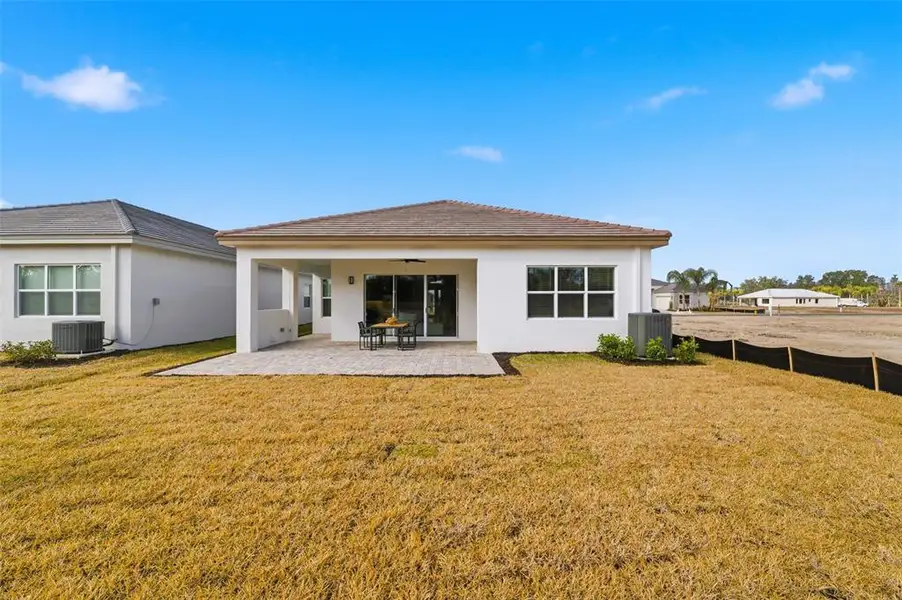 Exterior details and patio area of a home in Valencia Ridge, Wesley Chapel (Image 3).