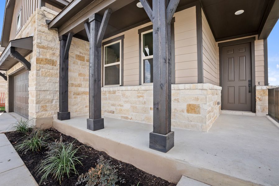 Representative exterior photo of a completed home built from the Texoma by Ashton Woods in The Colony 50s, Bastrop, TX (Image 18).