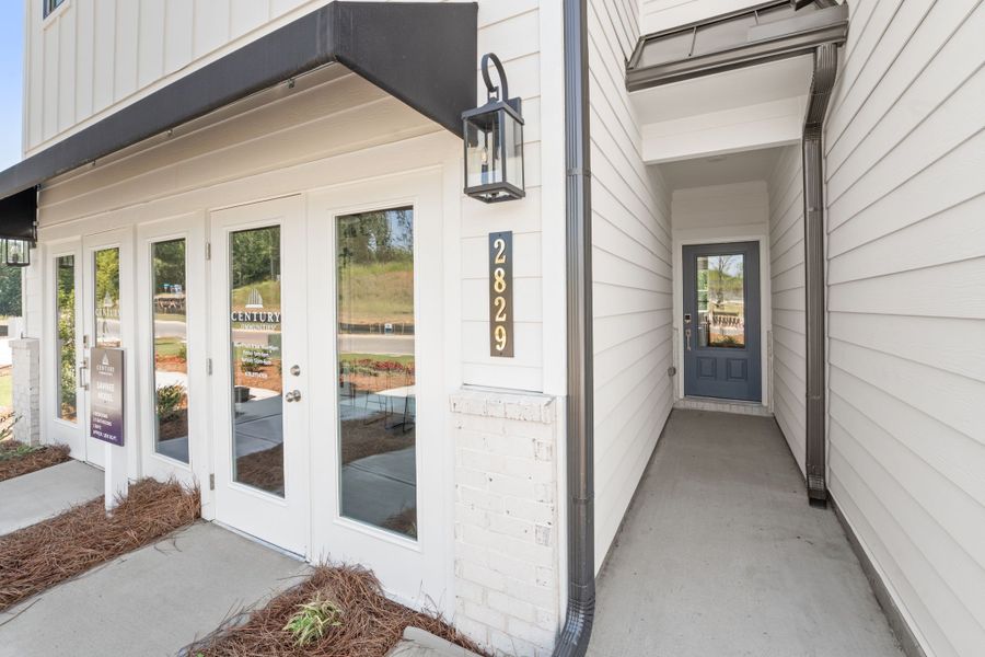 A white building with glass doors. A white building with glass doors.