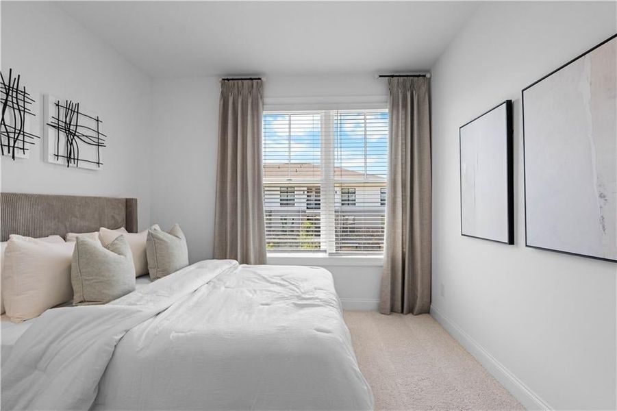 Guest Bedroom #2 on upper Level with private full bath *Images shown are from a decorated model of the same floor plan. Design selections and color packages will vary by home.*