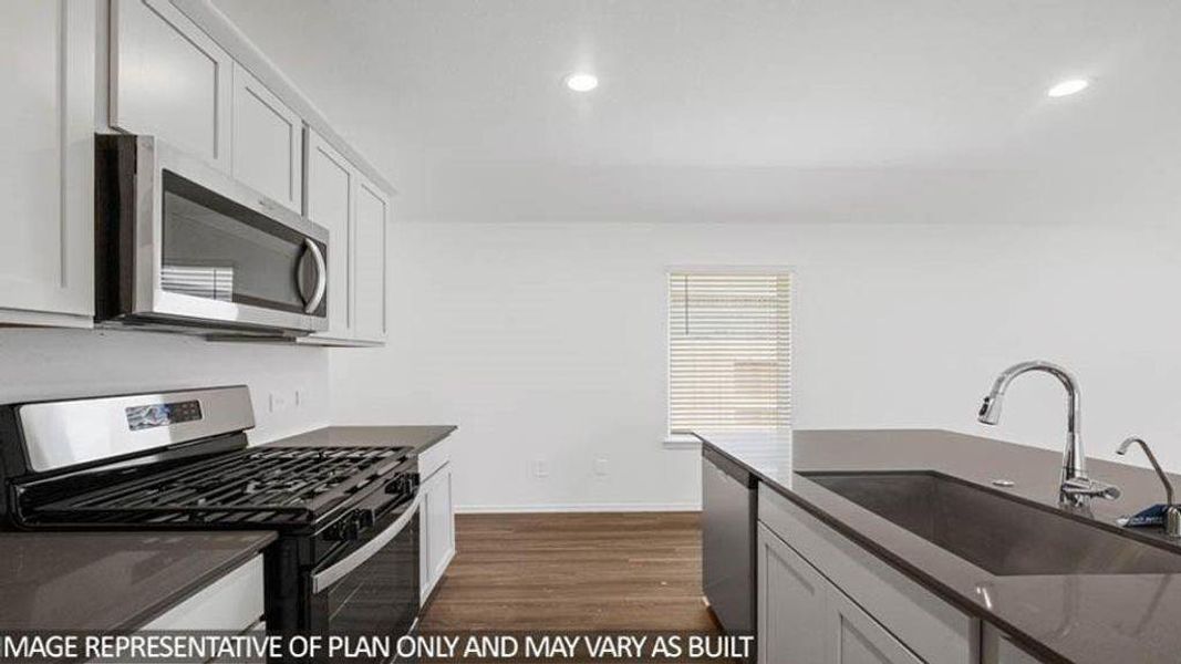 Furnished interior view inside a new home in Sunterra, Katy (Image 5).