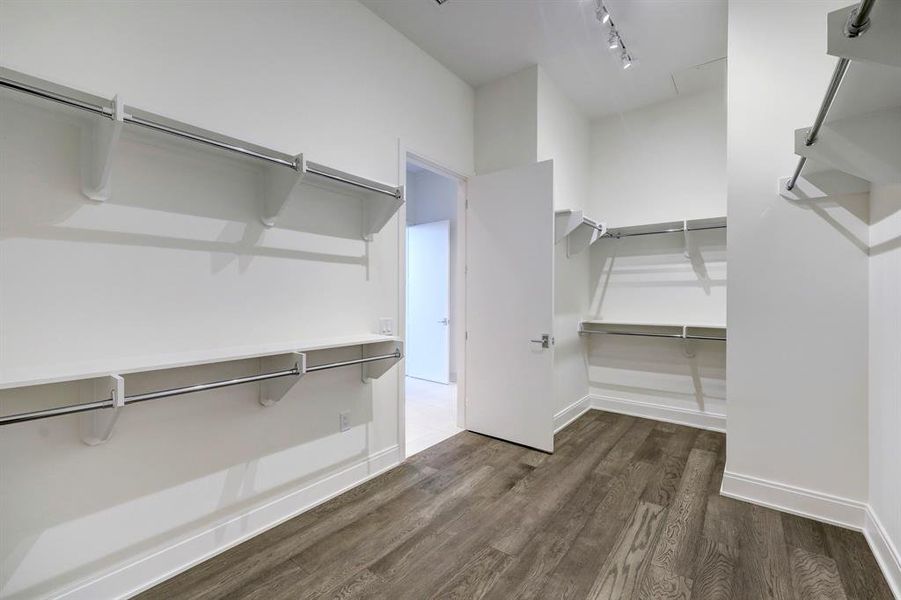 The primary suite's truly massive walk-in closet organizes even the most extensive wardrobes.