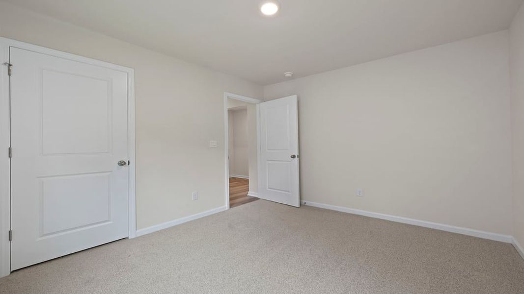 Spacious, unfurnished interior of a new home in Bentley Park, Greenwood (Image 16).