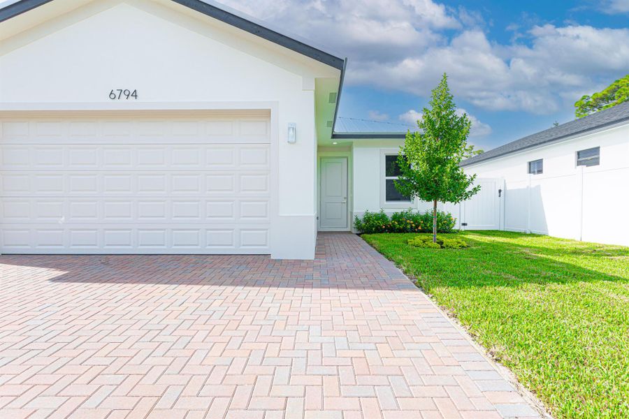 Front exterior of a new home in , Jupiter, FL, highlighting curb appeal (Image 17).