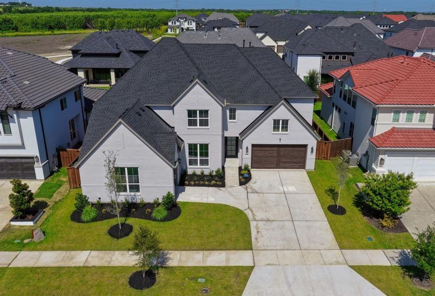 Front exterior of a new home in , Frisco, TX, highlighting curb appeal (Image 21). Front exterior of a new home in , Frisco, TX, highlighting curb appeal (Image 21).