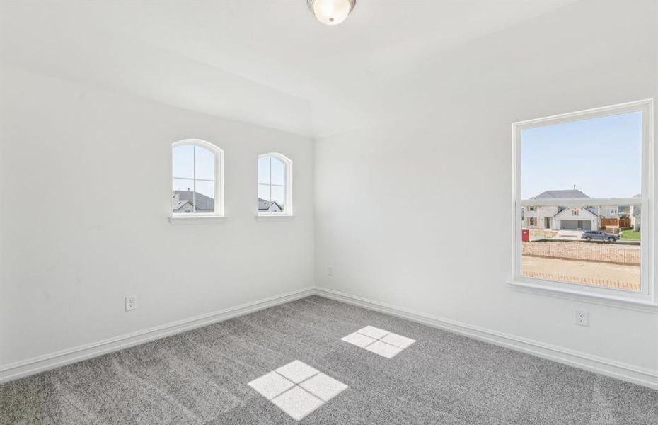 Roomy secondary bedroom with extensive closet storage Roomy secondary bedroom with extensive closet storage