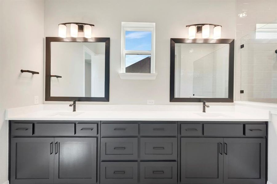 Full bathroom with double vanity and a shower stall Full bathroom with double vanity and a shower stall