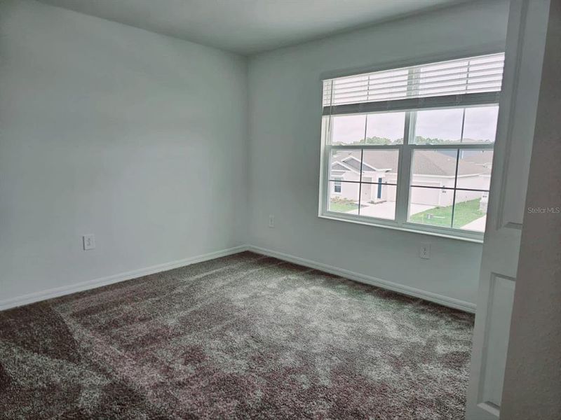 Spacious, unfurnished interior of a new home in Peace Creek Reserve, Winter Haven (Image 17).