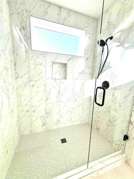 Bathroom featuring a marble finish shower