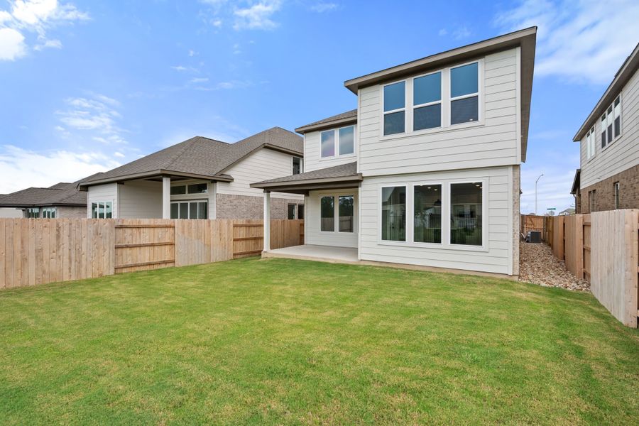 Exterior details and patio area of a home in Lariat, Liberty Hill (Image 31).