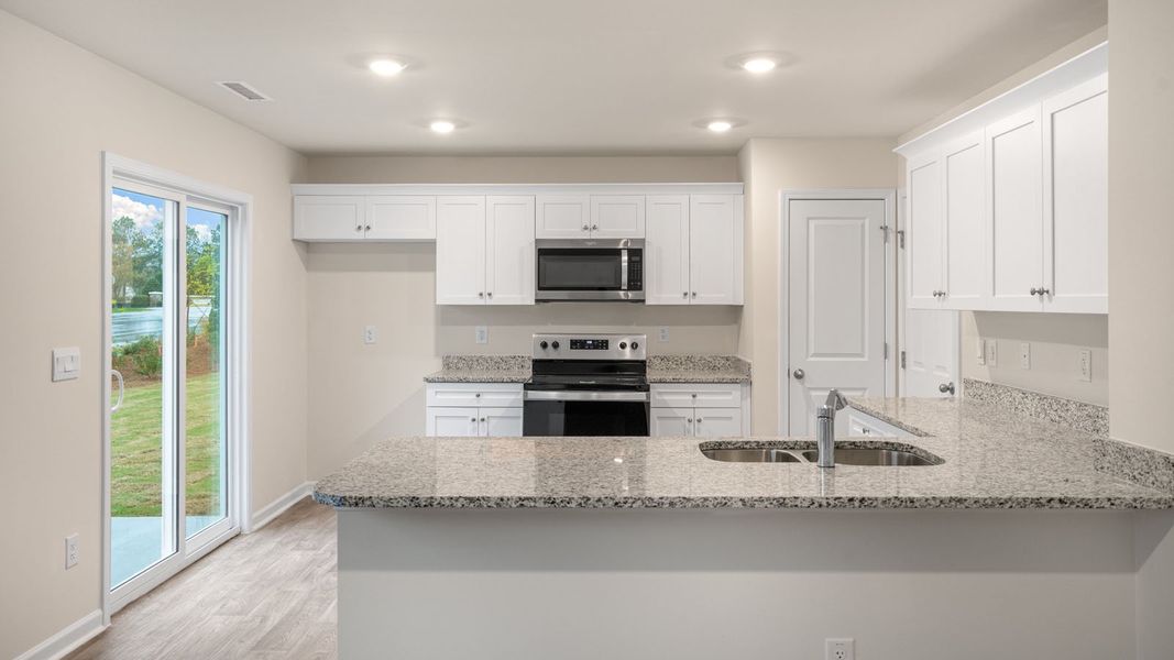Furnished interior view inside a new home in Hobbs Farm, Ayden (Image 5).