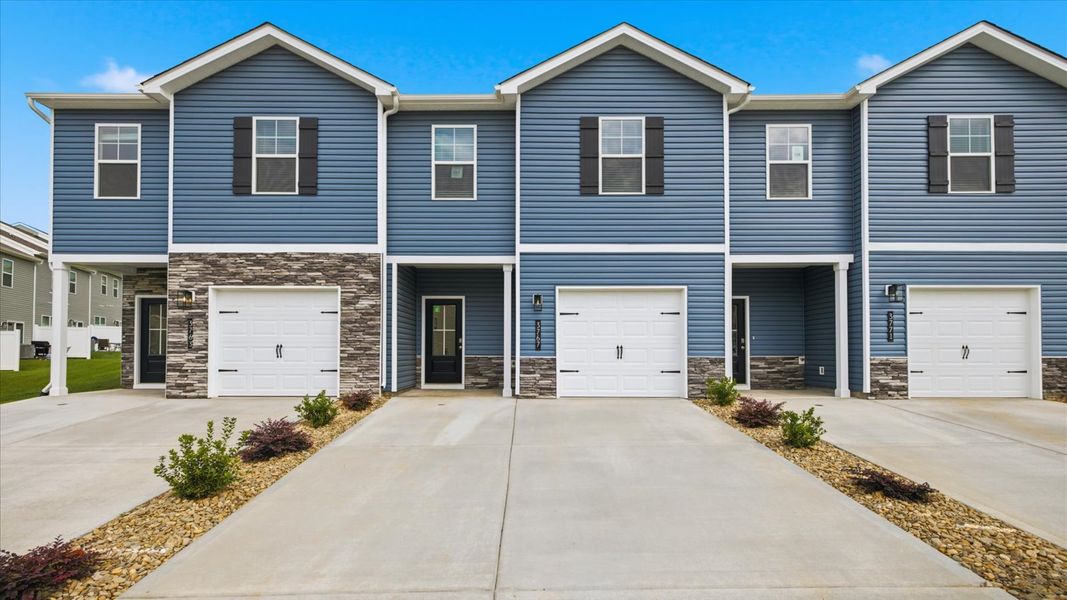 Front exterior of a new home in Cherokee Crossing, Kodak, TN, highlighting curb appeal (Image 1). Front exterior of a new home in Cherokee Crossing, Kodak, TN, highlighting curb appeal (Image 1).