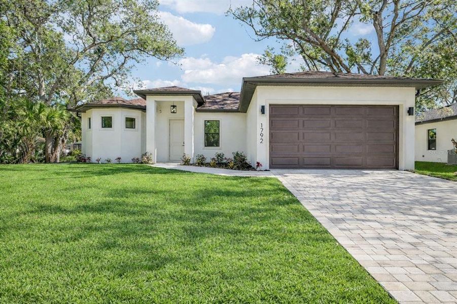 Front exterior of a new home in , North Port, FL, highlighting curb appeal (Image 24).
