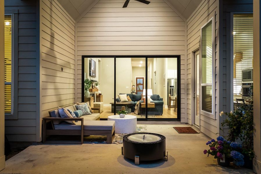 Expansive outdoor patio featuring a concrete surface and a vaulted ceiling Expansive outdoor patio featuring a concrete surface and a vaulted ceiling