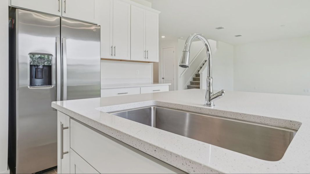 Plumeria Floor Plan featuring a bright kitchen with large island by DRB Homes in Trailside located in Mount Dora, FL Plumeria Floor Plan featuring a bright kitchen with large island by DRB Homes in Trailside located in Mount Dora, FL