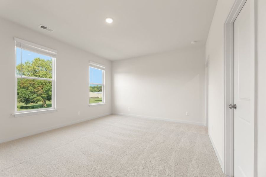 A room with windows and a door.