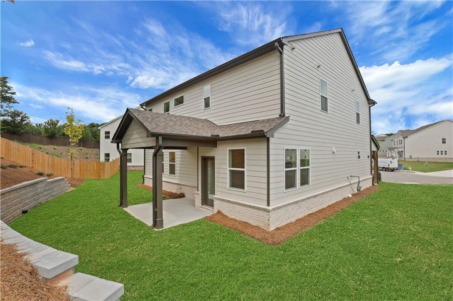 Exterior details and patio area of a home in The Paddocks at Doc Hughes, Buford (Image 4).
