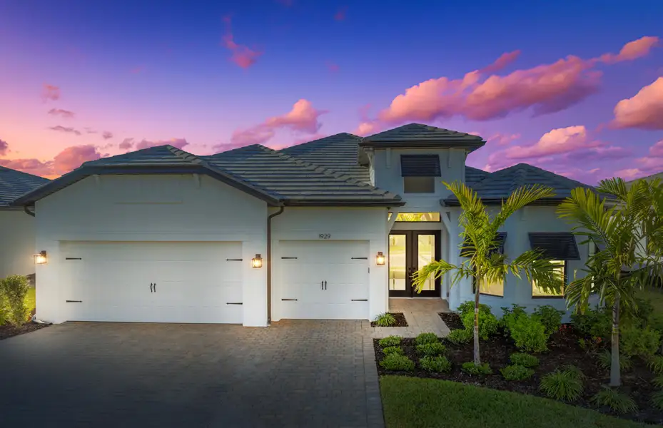 Front exterior of a new home in Terreno, Naples, FL, highlighting curb appeal (Image 1). Front exterior of a new home in Terreno, Naples, FL, highlighting curb appeal (Image 1).