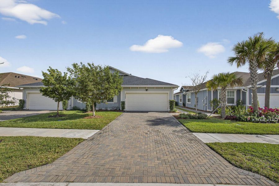 Front exterior of a new home in , Loxahatchee, FL, highlighting curb appeal (Image 20).