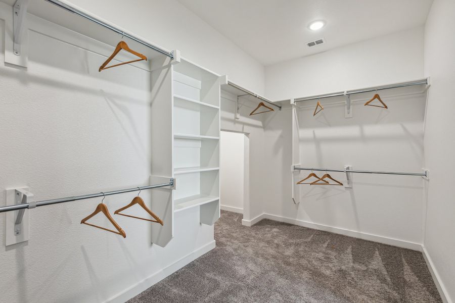 Primary Closet in the Wimbledon home plan by Trophy Signature Homes – REPRESENTATIVE PHOTO