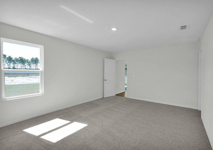 Rest and relaxation await in master bedroom