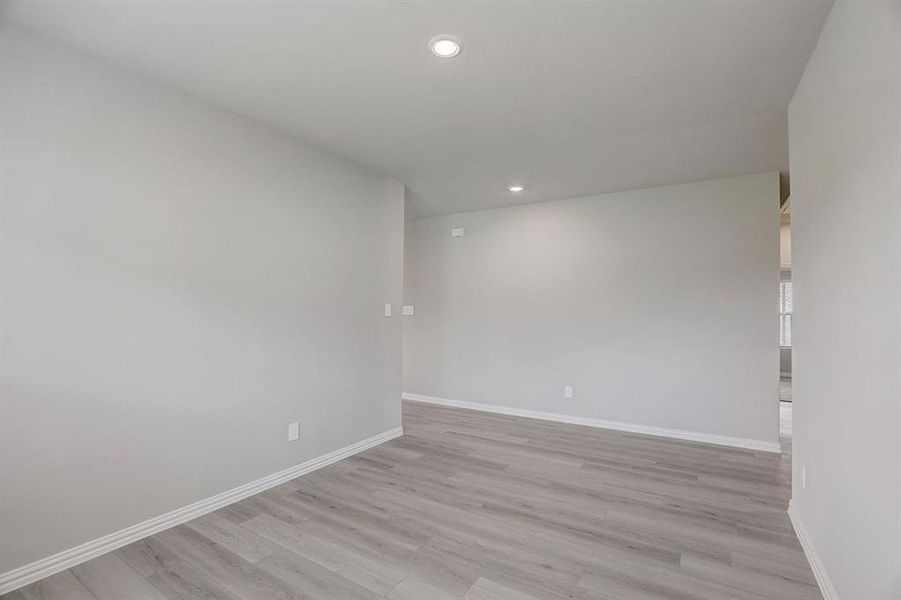 Empty room with light wood-type flooring