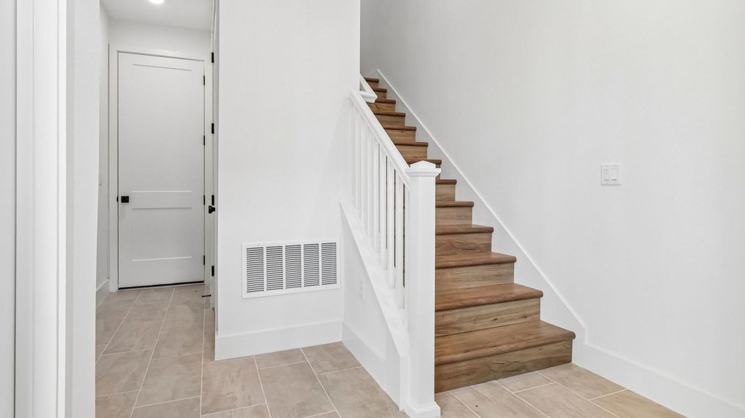Furnished interior view inside a new home in Parkview at Hamlin, Winter Garden (Image 7).
