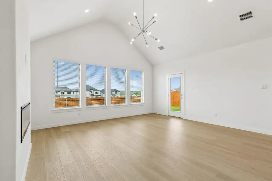 Living Room in the Claret home plan by Trophy Signature Homes – REPRESENTATIVE PHOTO