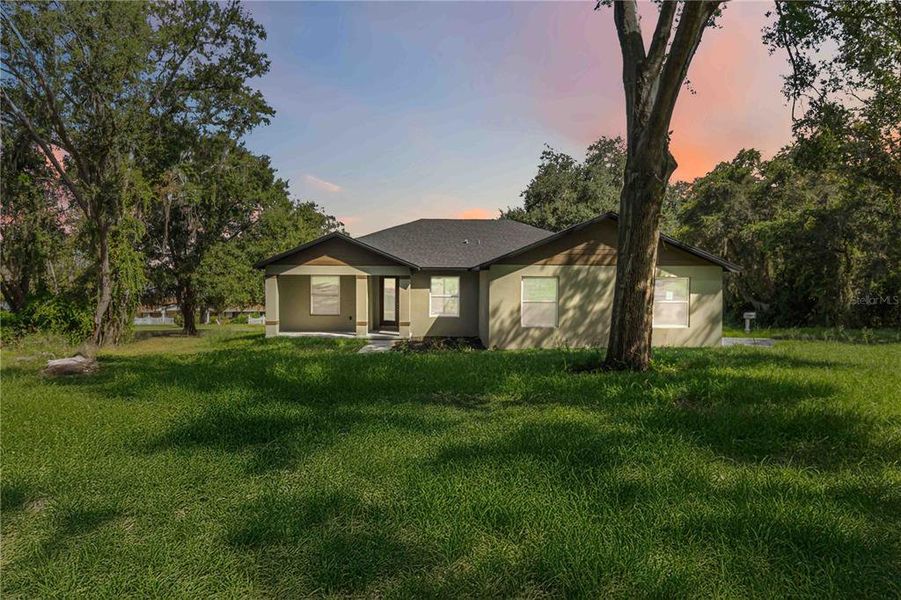 Front exterior of a new home in , Clermont, FL, highlighting curb appeal (Image 26).
