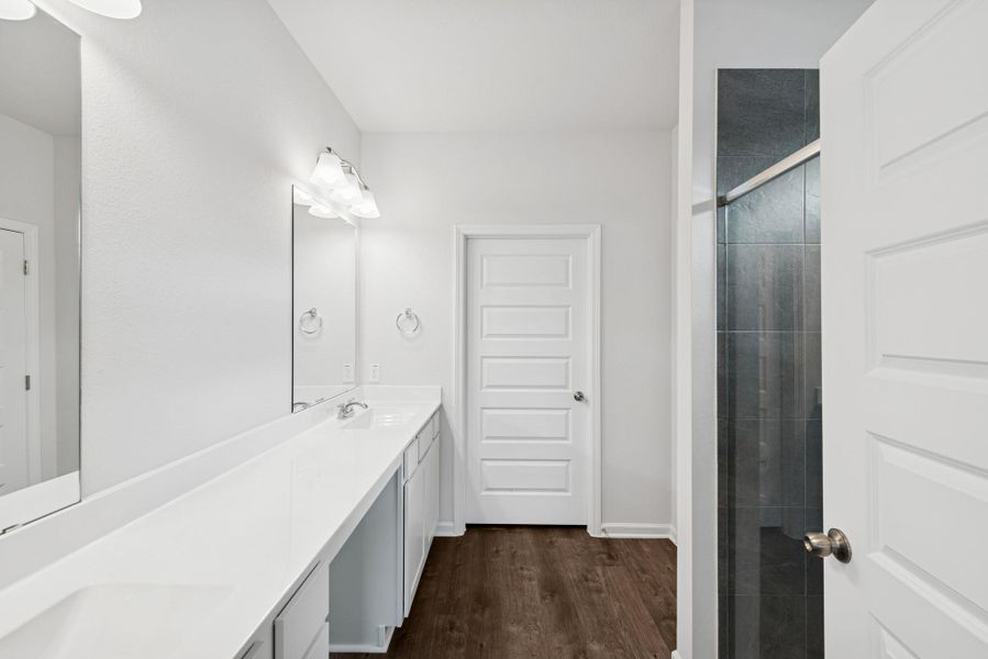 The Crawford- Primary Bathroom with Dual Vanities and Walk-In Shower The Crawford- Primary Bathroom with Dual Vanities and Walk-In Shower