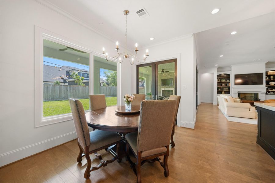 Light and bright breakfast room with an open flow to the living room and kitchen.