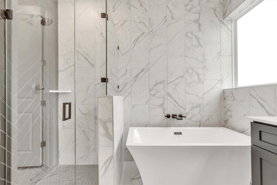 Luxurious spa-like bathroom with a modern freestanding tub and an elegant walk-in shower.