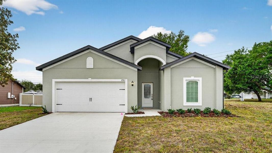 Front exterior of a new home in , Deltona, FL, highlighting curb appeal (Image 20). Front exterior of a new home in , Deltona, FL, highlighting curb appeal (Image 20).