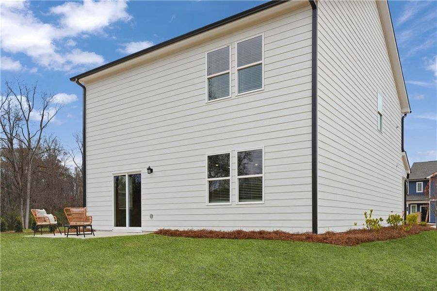 Exterior details and patio area of a home in Crossvine Village, LaGrange (Image 2).